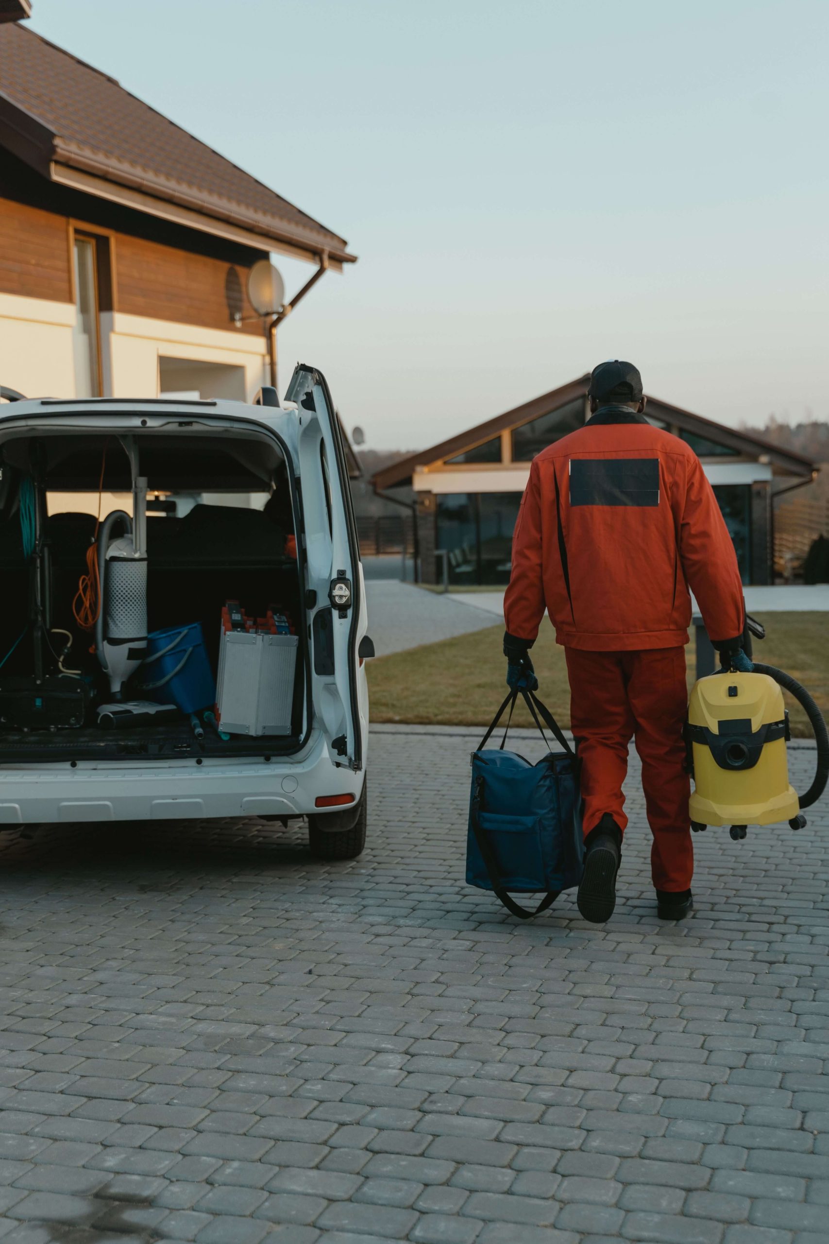 Anytown Home Services technician unloading equipment
